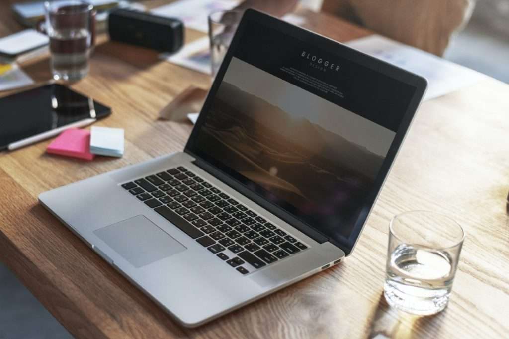 Laptop displaying local SEO and Google Ads comparison for Metro Detroit small businesses