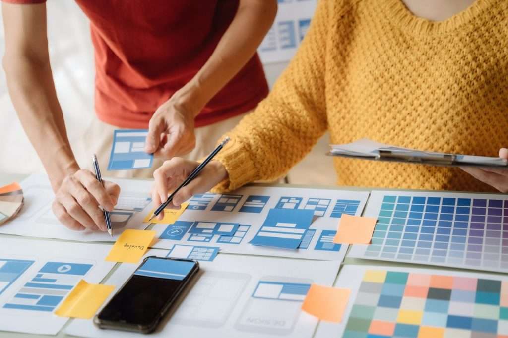 Digital marketing team reviewing a local business website for AI search optimization